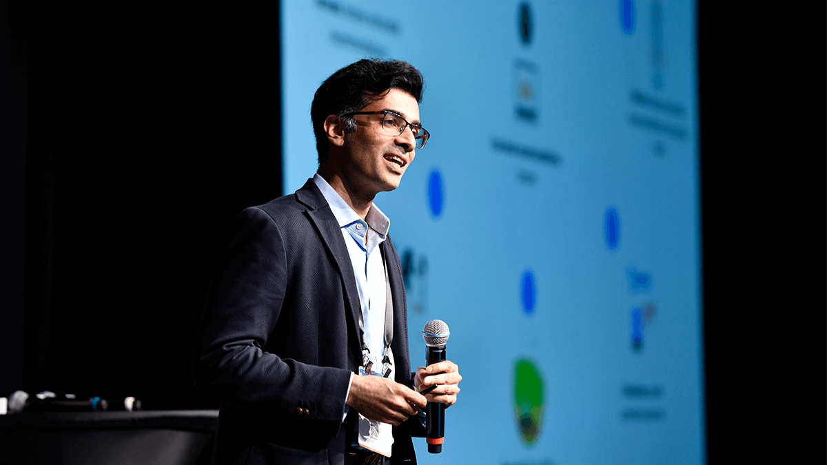 Man speaking at a conference